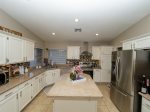 Kitchen w/ stainless steel appliances and open dining area